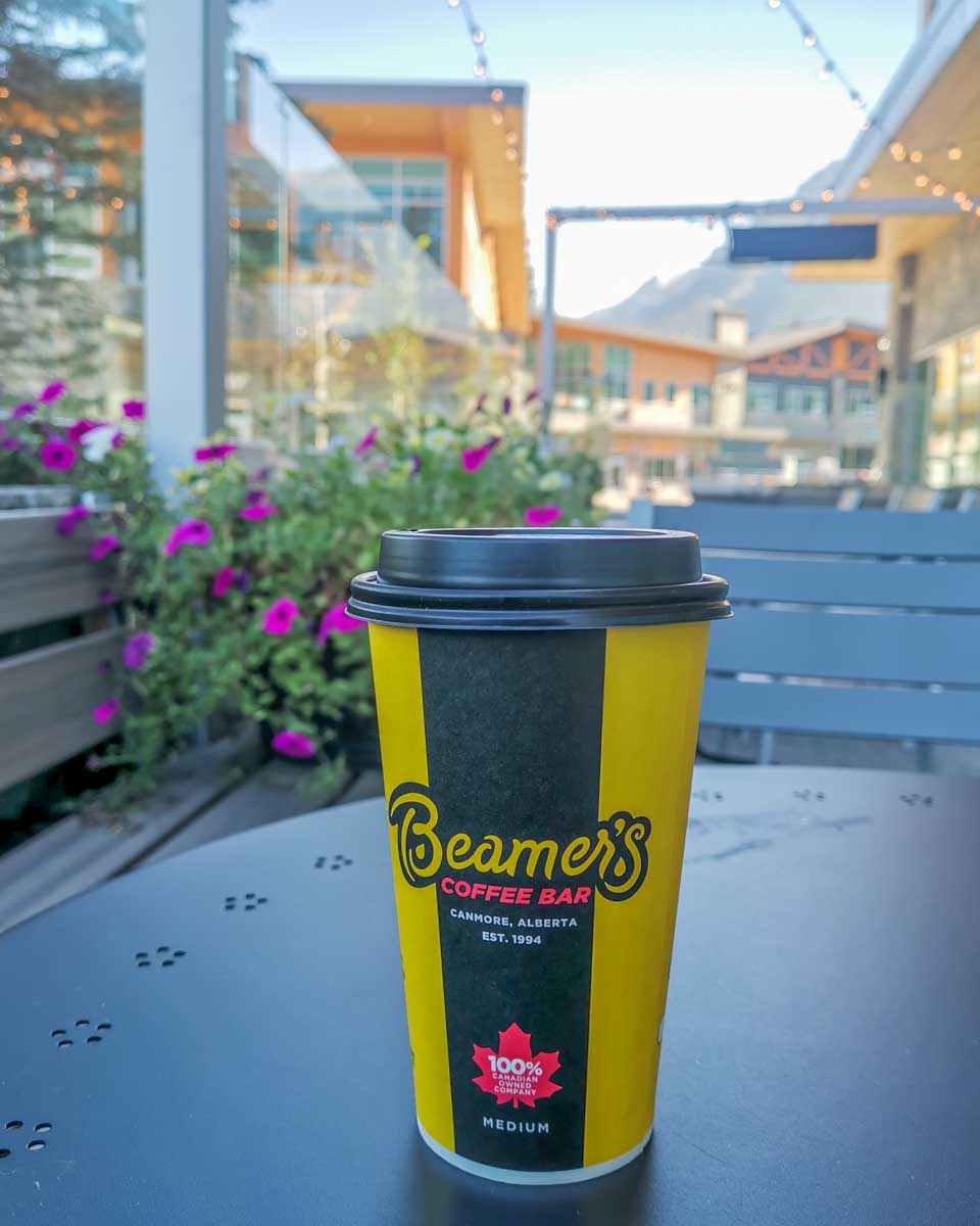 yellow and black coffee cup from beamers coffee house in canmore