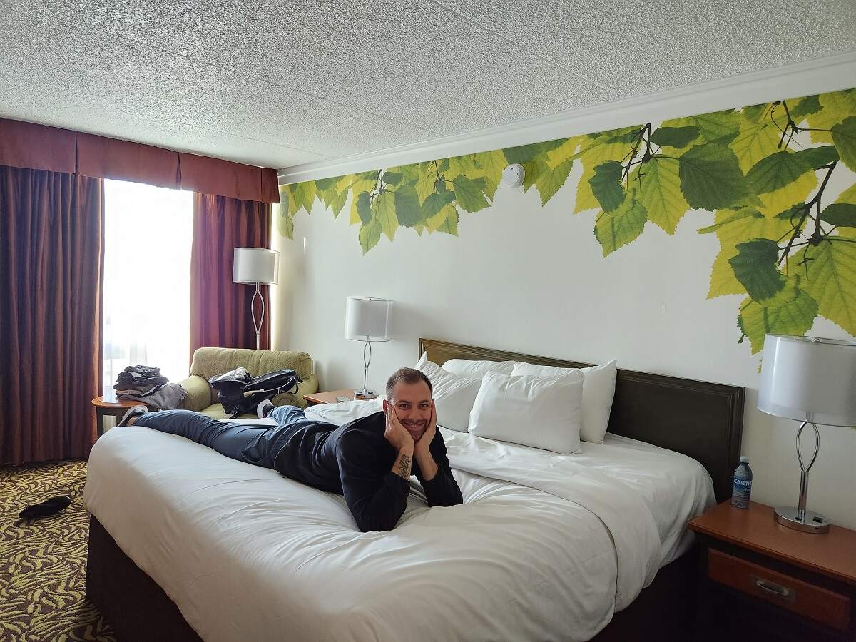 Daniel poses in a room at Varscona Hotel Whyte Ave
