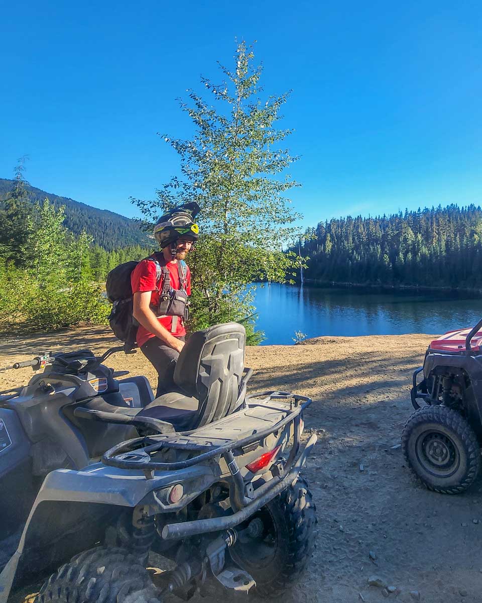 An ATV guide talks about the area during a stop on a tour in Whistler, BC
