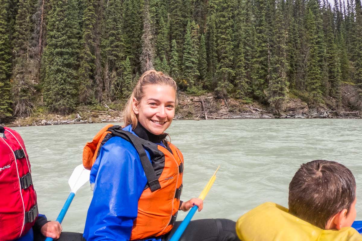 Bailey smiles at the camera while white water rafting in Canada