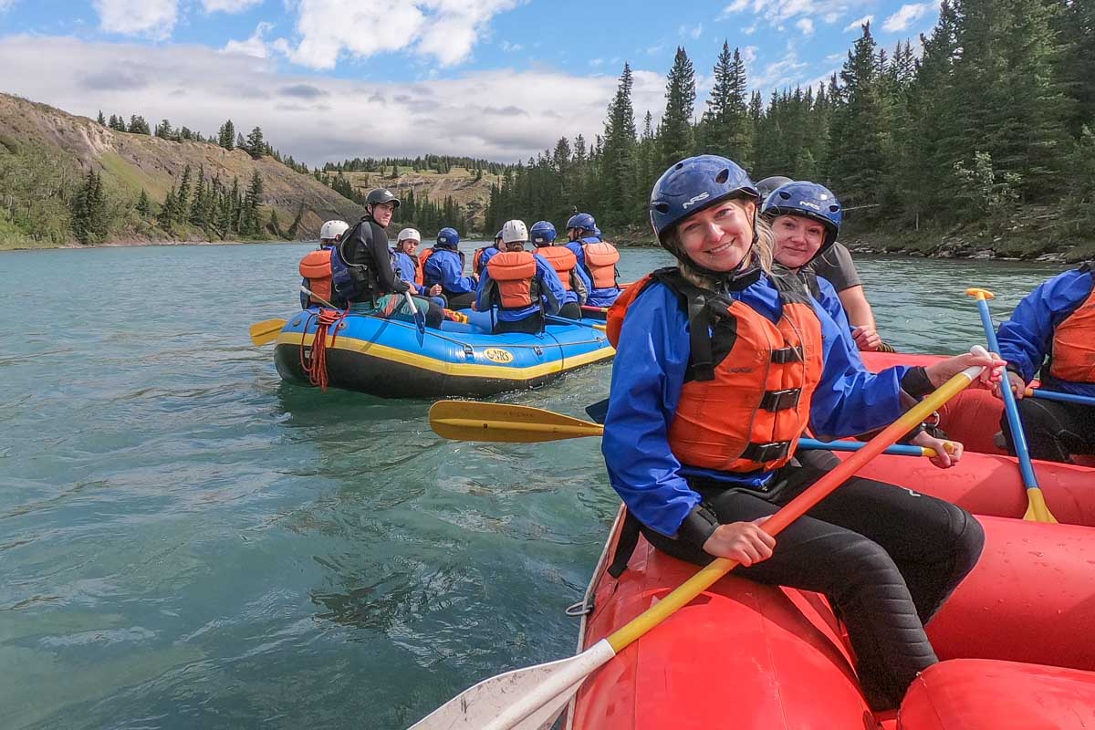 Bailey smiles while white water rafting in Clearwater BC in Wells Gray Provincial Park, Canada