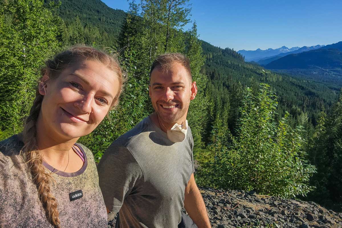 Daniel and Bailey take a selfie at a viewpoint on an ATV tour in Whistler, BC