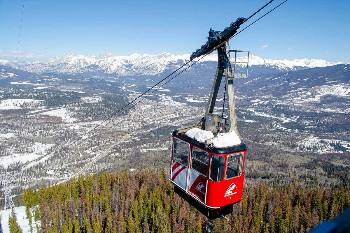 Jasper Sky Tram travels up the moun tain with Snow on the tram