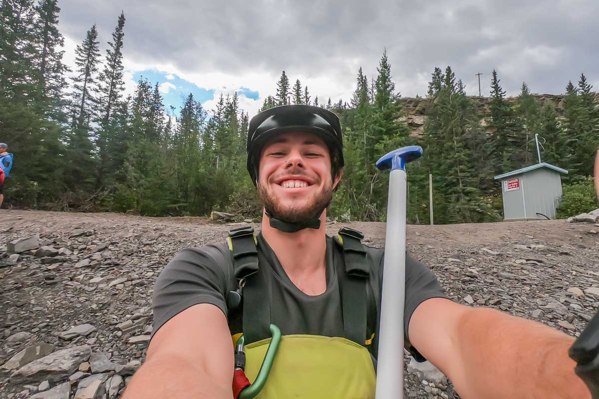 Our guide takes a selfie with our go pro while white water rafting in Banff