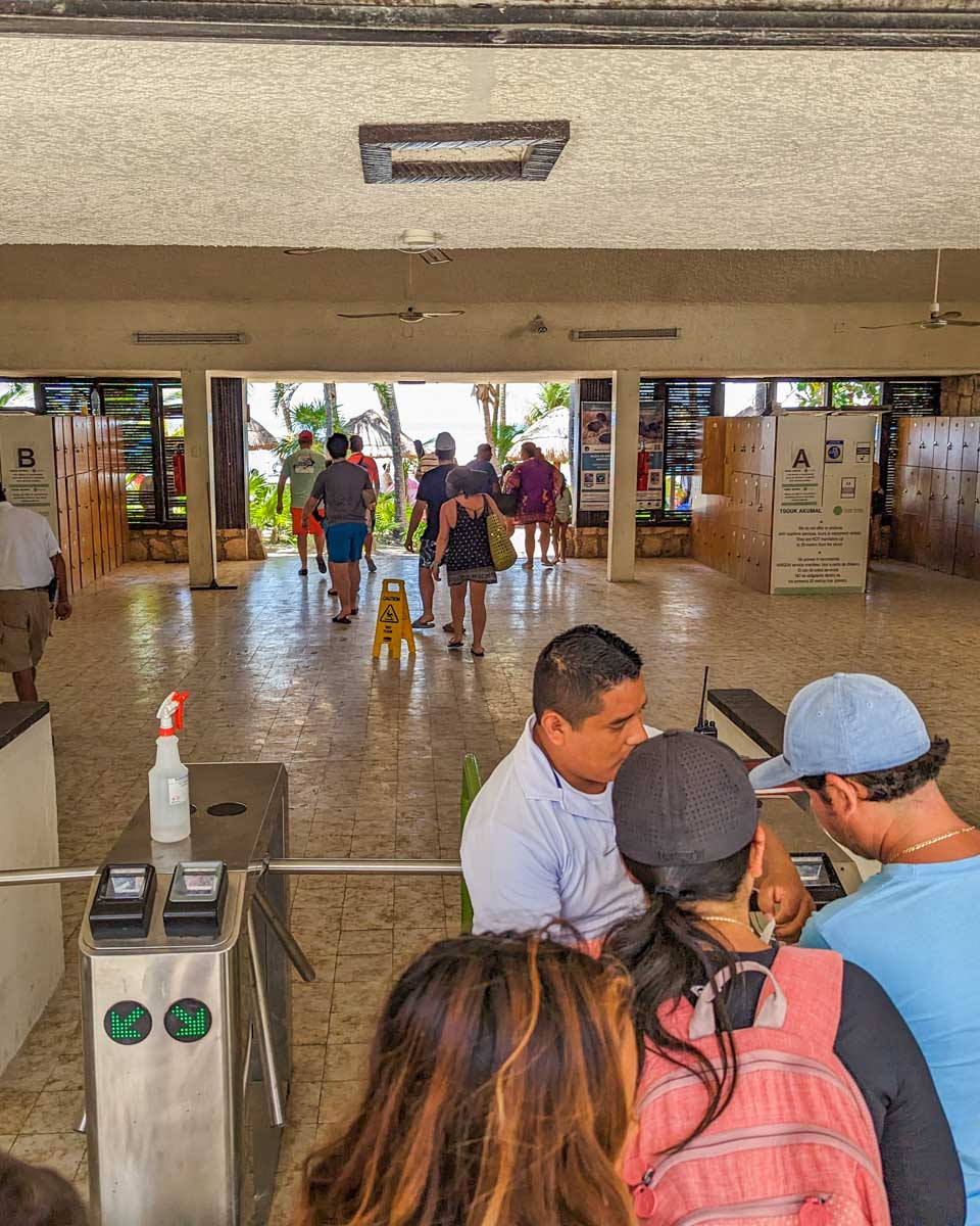 A man checks tickets at Akumal Beach in Mexico