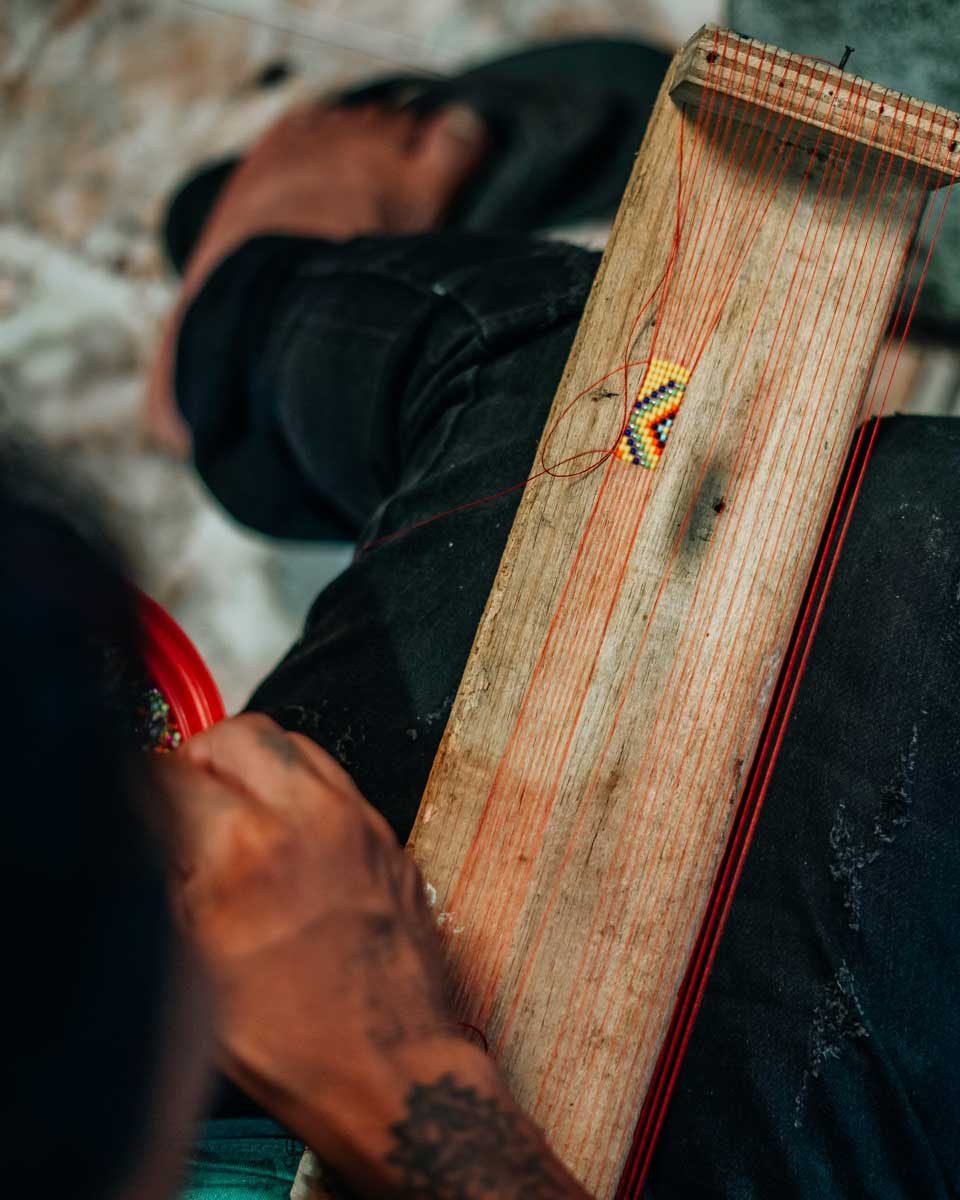 A person creates art at Embera Indigenous Village 