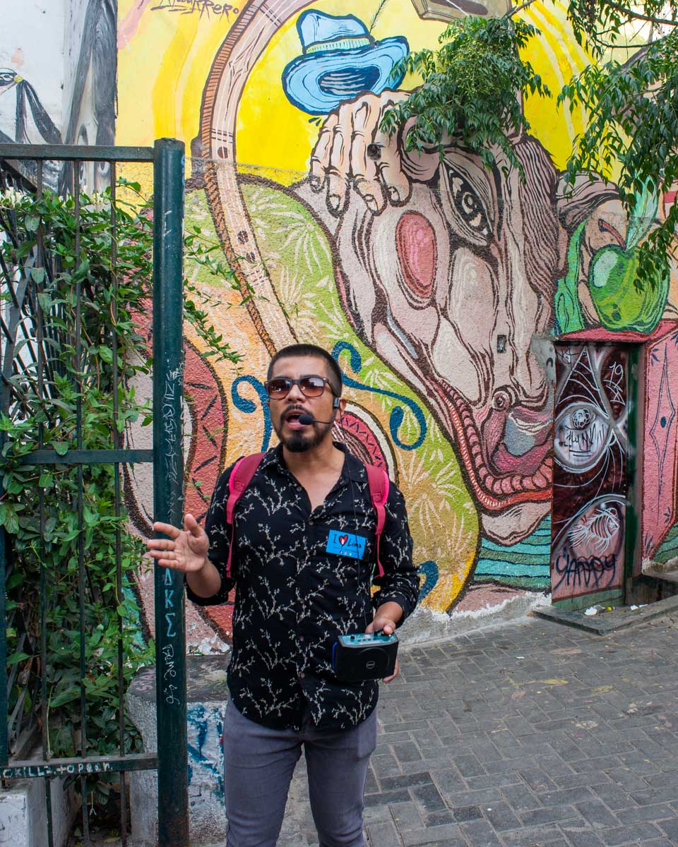 A tour guide speaks to us during a city tour in Lima
