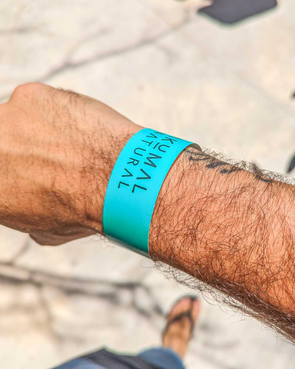 A wrist band for Akumal Beach on Daniels wrist