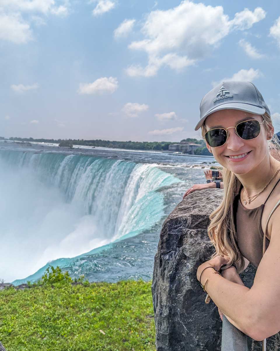 Bailey leans over the railing on the Canadian side of Niagara Falls