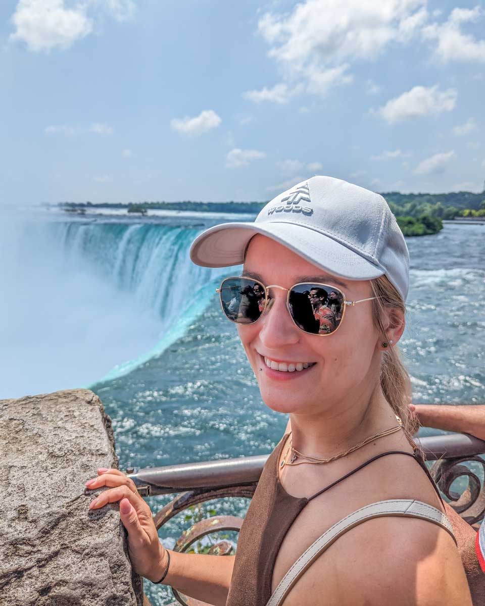 Bailey smiles at the Camera at a viewpoint of Niagara Falls, Canada
