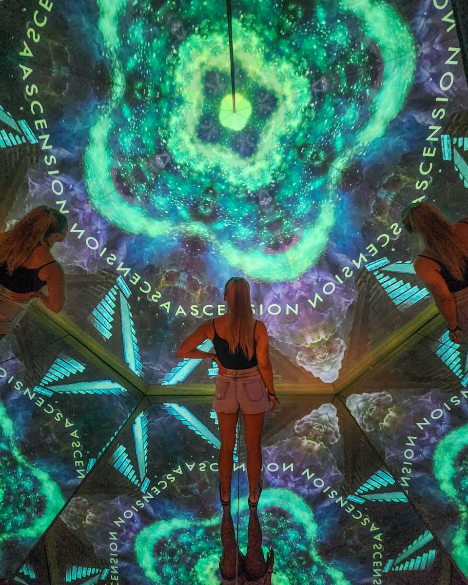 Bailey watches a display at the Mystika Immersive, Tulum