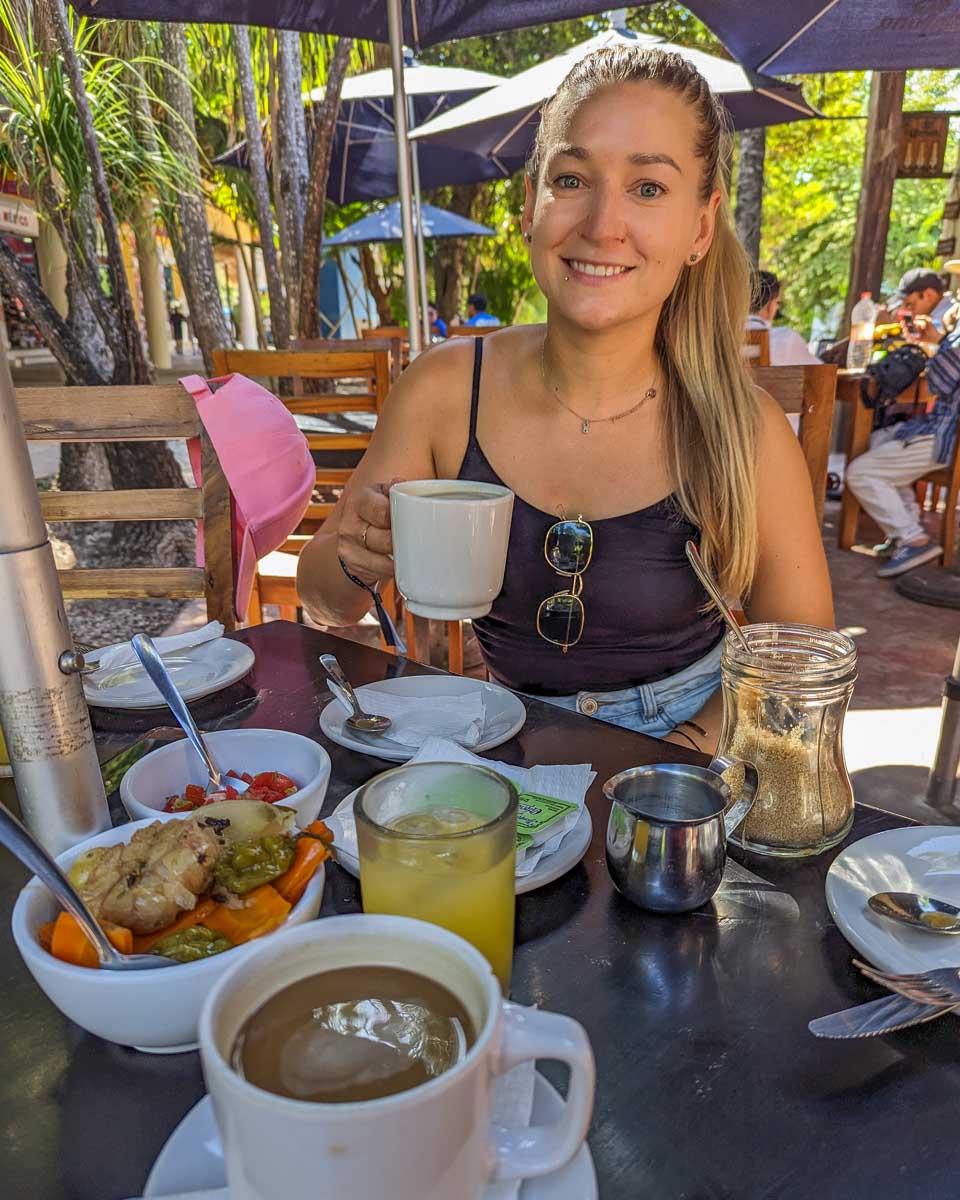 Bailey with coffee and breakfast at Don Cafeto Tulum Ruinas
