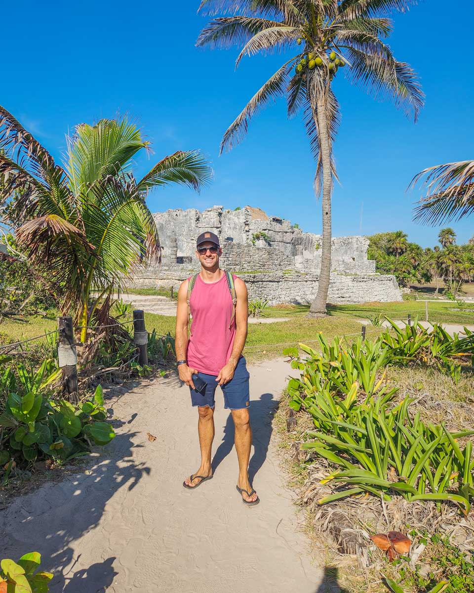 Daniel poses for a photo at the Tulum Ruins in Tulum, Mexico