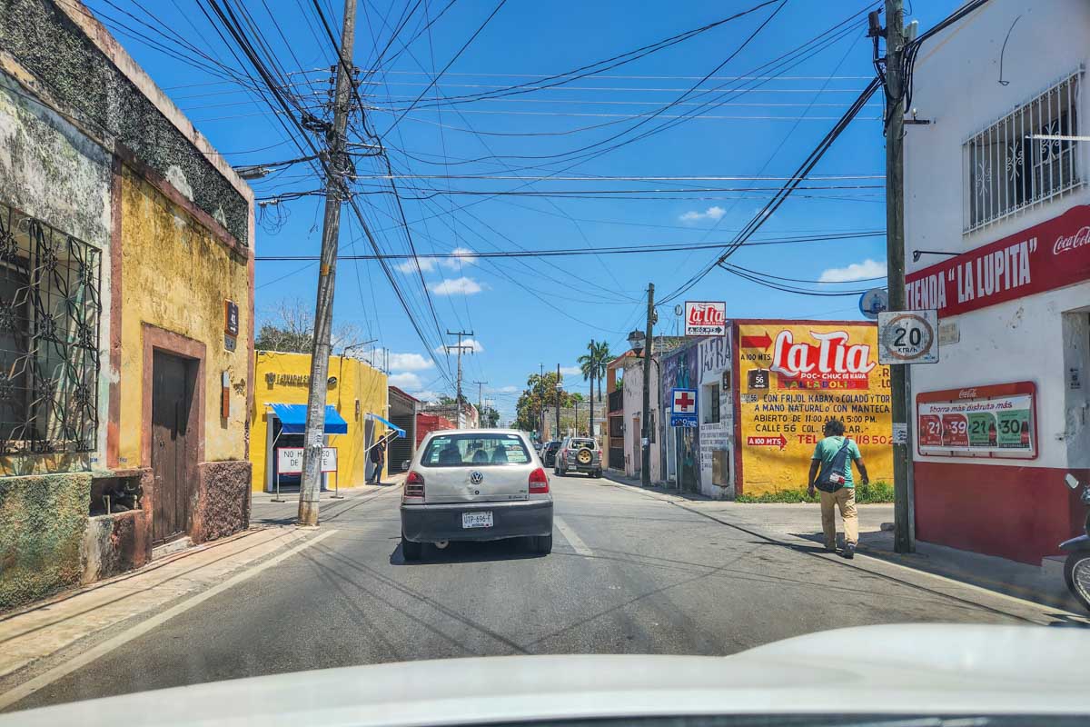 Driving along a small street in Mexico in a rental car