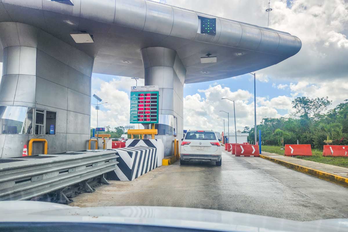 Entering a toll booth in our rental car in Mexico