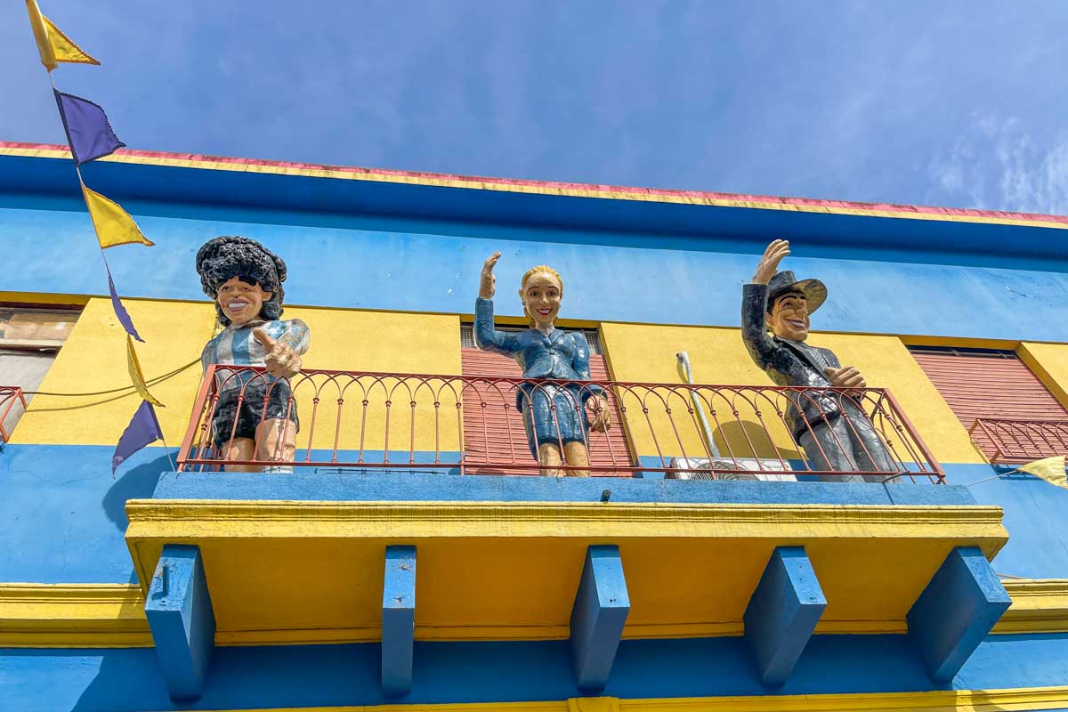 Statues on a colorful balcony in the Boca neighborhood in Buenos Aires, Argentina