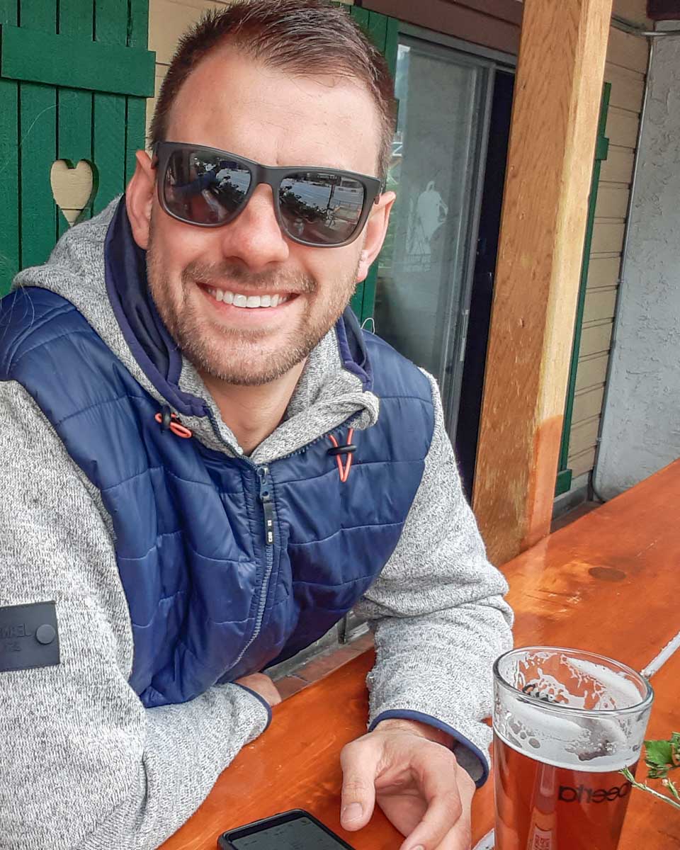 Daniel drinks craft beer on a patio in Vancouver