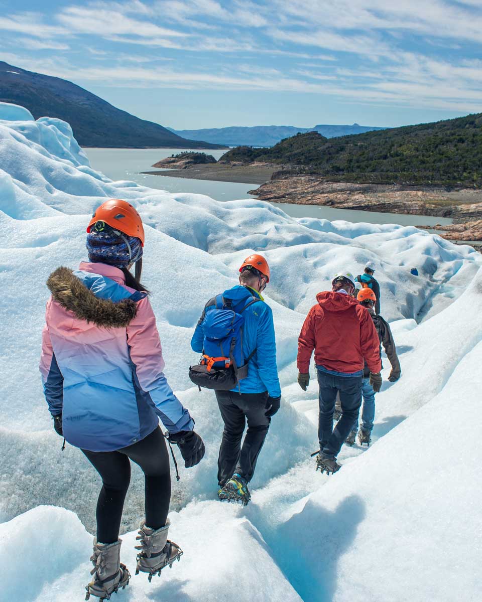 A group of tourists walk on the Perito Moreno Glacier on the mini trekking tour