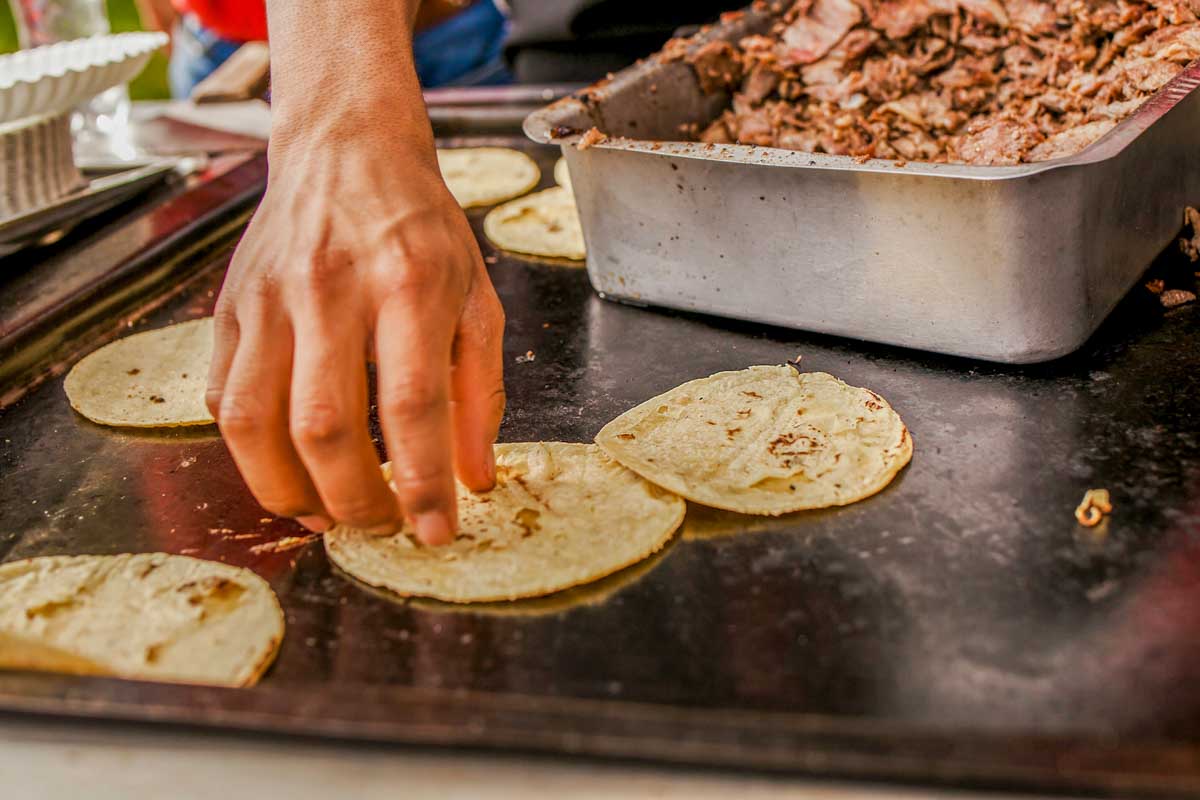 A man cooks tortillas in Mexico City
