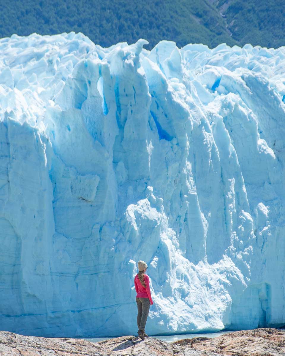 Bailey appears tiny in contrast to the face of the Perito Moreno Glacier