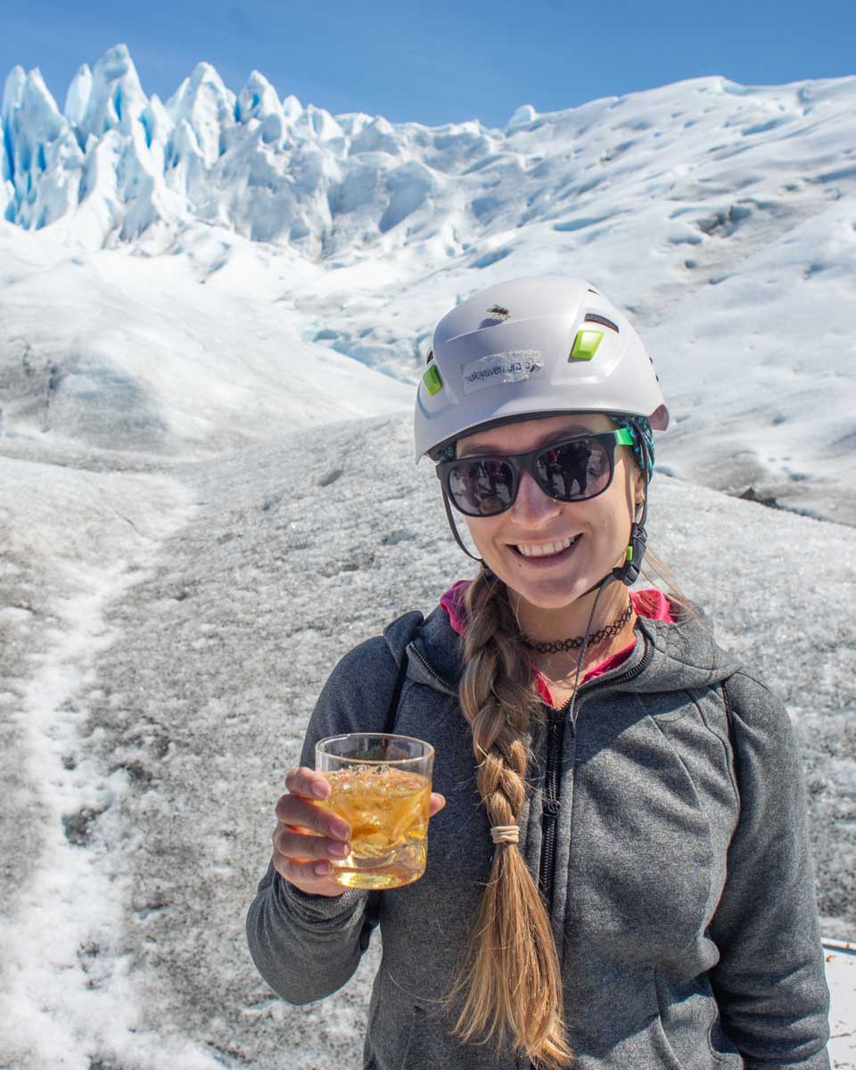 Bailey drinks scotch with glacier ice on the mini trekking glacier tour in Perito Moreno
