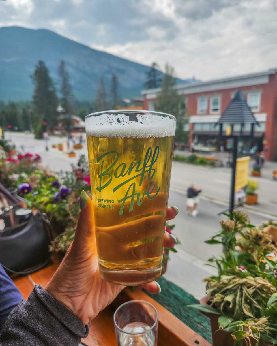 Bailey enjoys a bear at Banff Ave Brewing Company in Banff town
