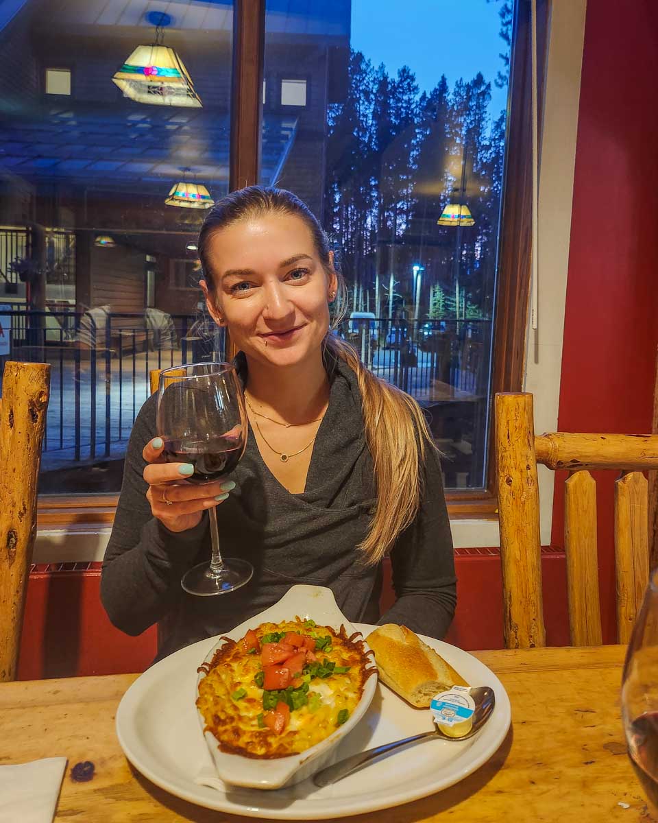Bailey enjoys a meal at Bill Peyto's Cafe in Lake Louise