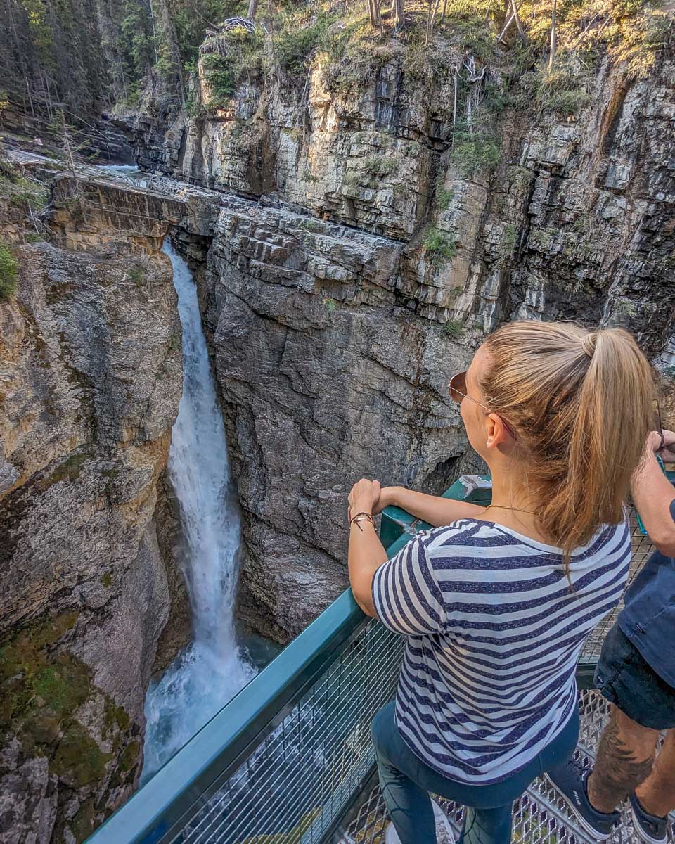 Bailey looks down at the Upper Falls at Johnston Canyon in Banff National Park