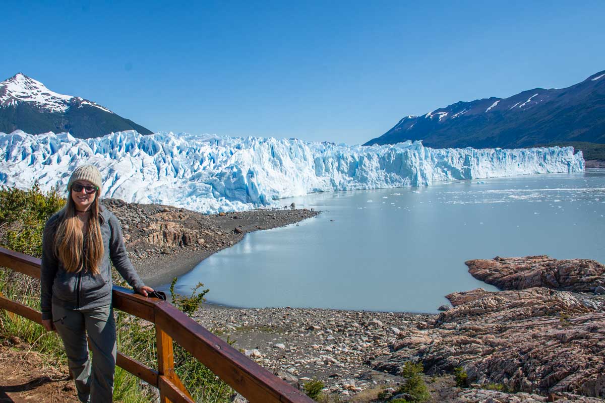 Bailey poses for a photo with the Perito Moreno Glacier in the background at the mini trekking area