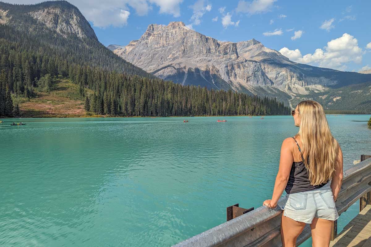 Bailey stands on the edge and admires the views at Emerald Lake in Yoho National Park