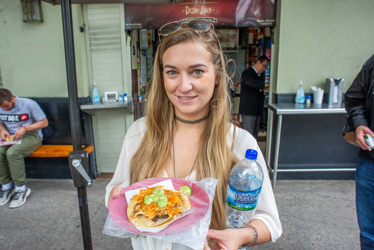 Bailey with a beef taco on a taco tour in Mexico City