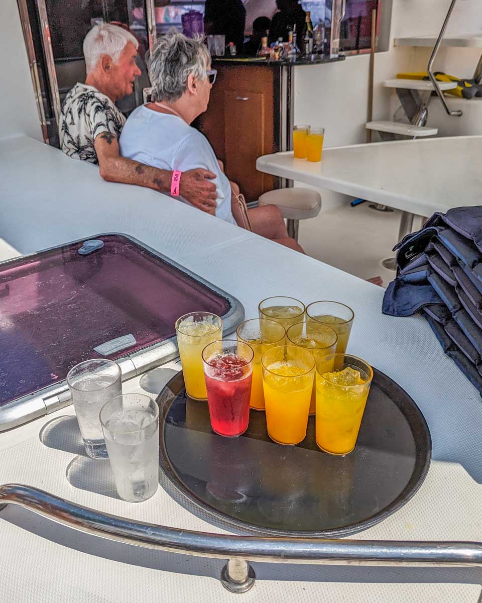 Cocktails onboard a catamaran cruise to Isla Mujeres from Cancun