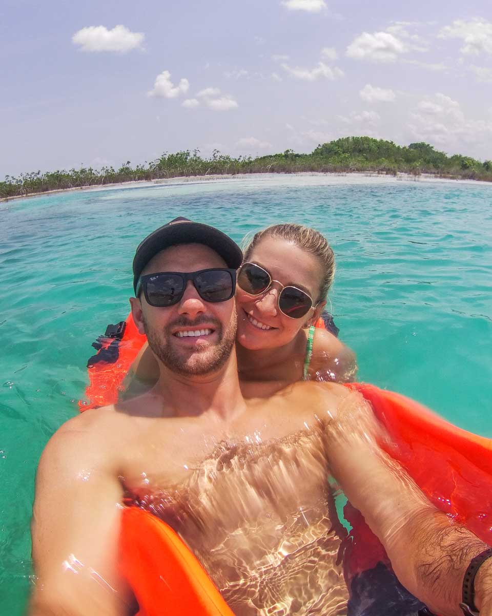 Daniel and Bailey take a selfie in Bacalar Lagoon on a boat tour