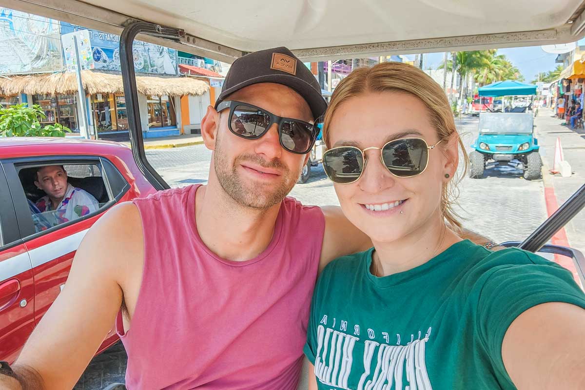 Daniel and Bailey take a selfie in a golf cart on Isla Mujeres, Mexico