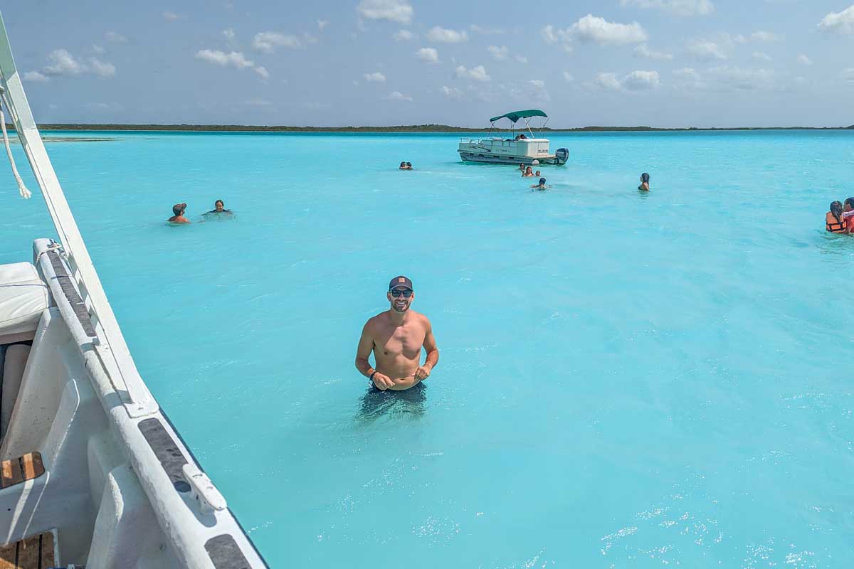 Daniel poses for a photo in Bacalar Lagoon on a tour