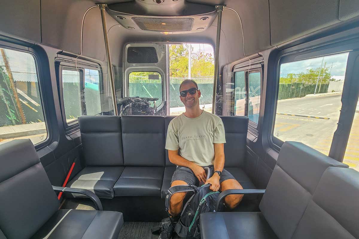 Daniel sits in a Cancun Airport shuttle