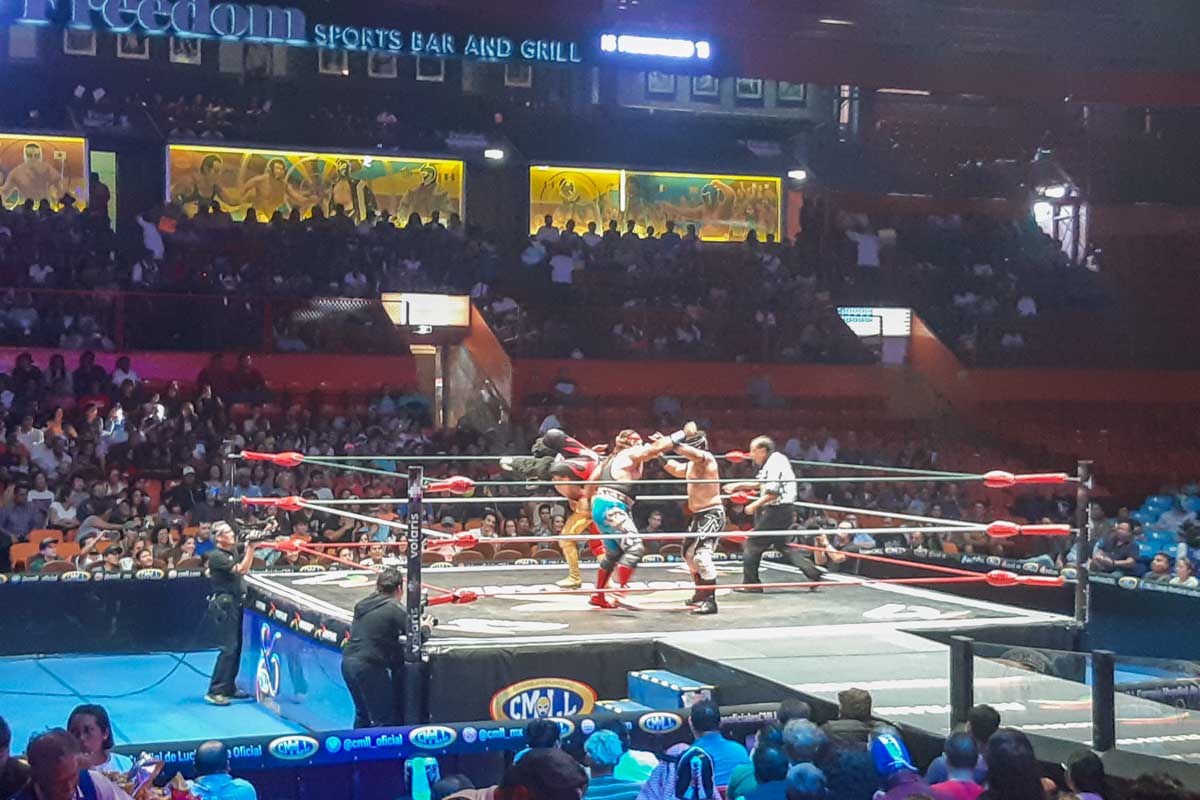 Four wrestlers fighting in Lucha Libre in Mexico City