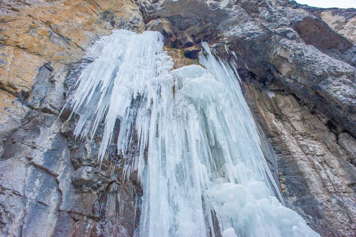 Ice from a frozen waterfall hangs above the grotto Canyon