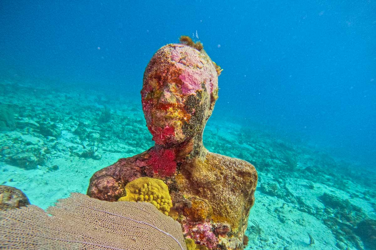 MUSA reef statue as seen while snorkeling in Cancun, Mexico