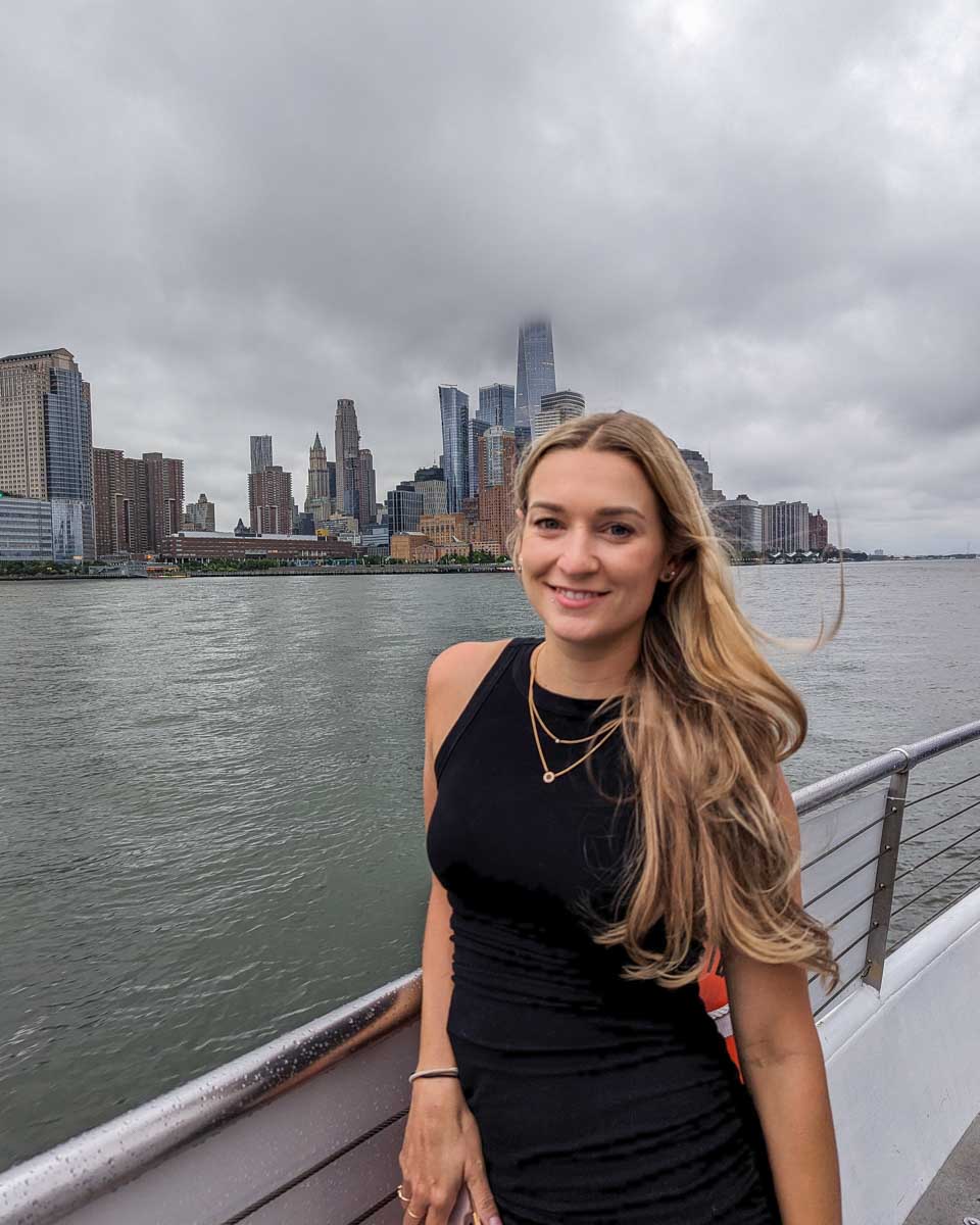 Bailey stands on the front deck and enjoys the view on a dinner cruise in New York City