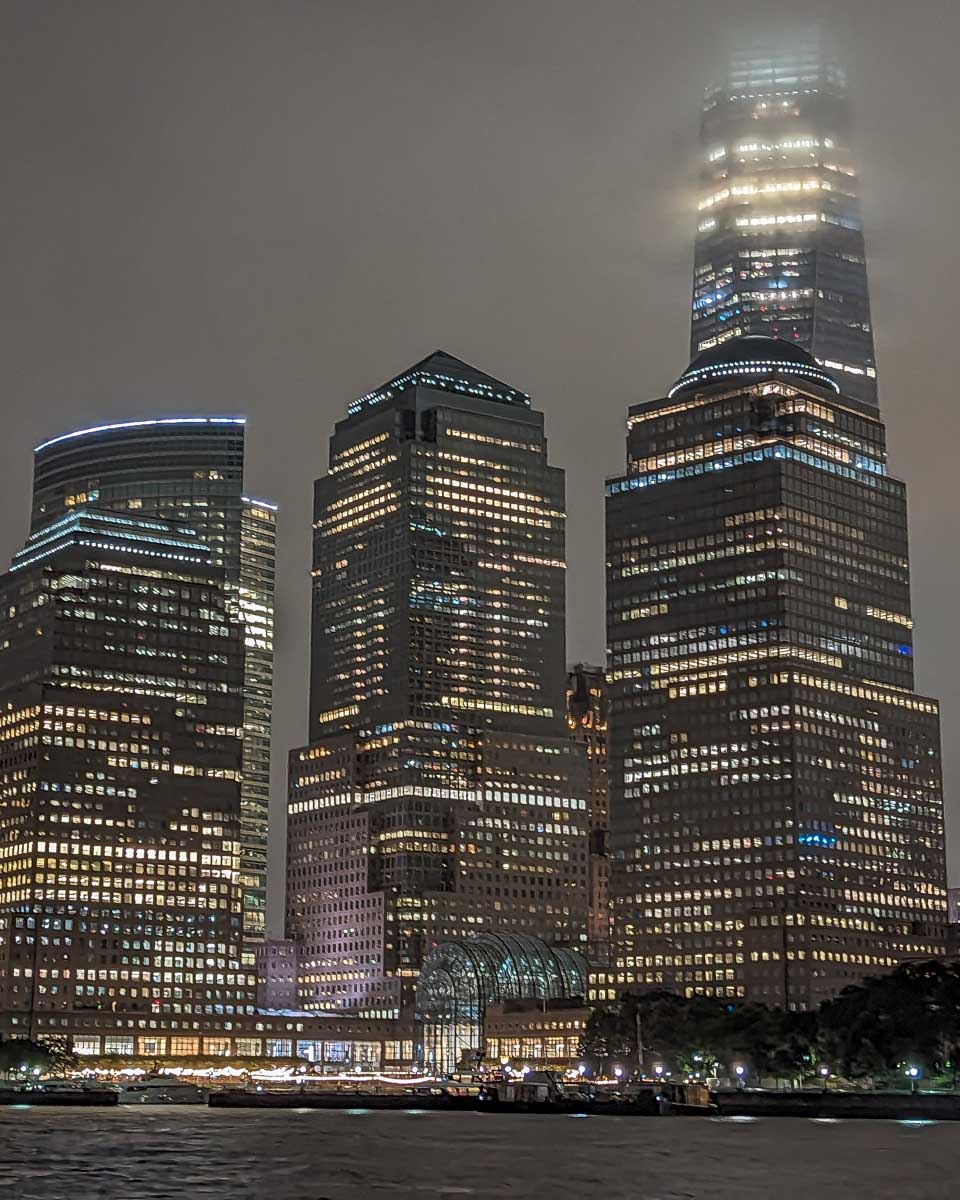 New York City skyline as seen from a dinner cruise at night
