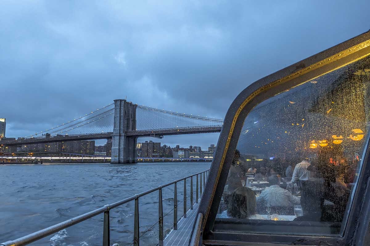 The Bateaux New York Premier Dinner Cruise with the Brooklyn Bridge in the background