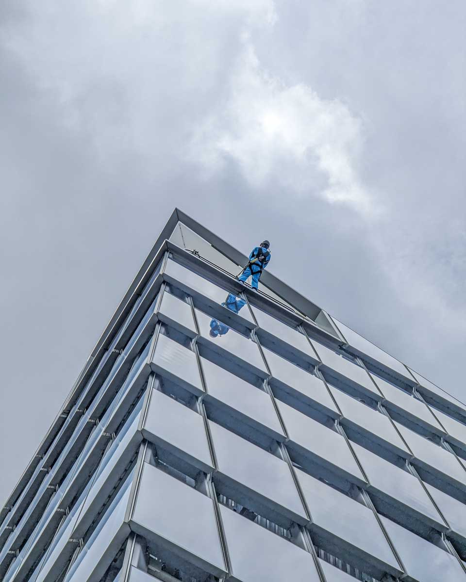 A man hangs on the Edge during the City Climb at the Edge NYC