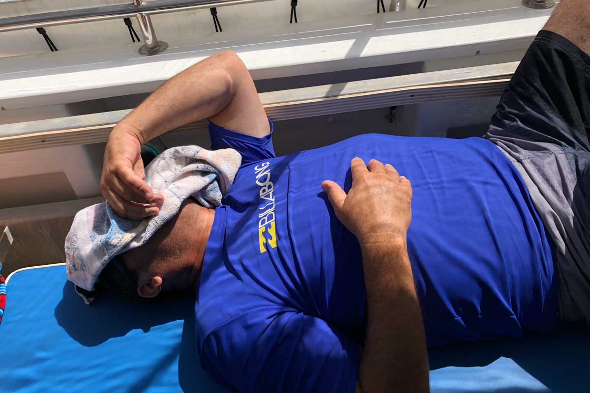 A person feels sick on a whale shark tour in Cabo San Lucas, Mexico