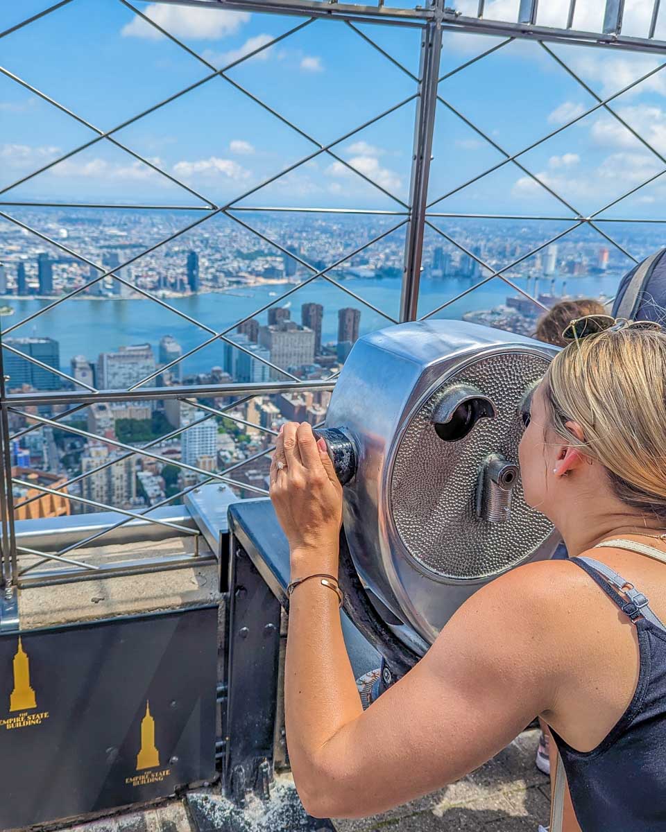 Bailey looks through the Binoculars on the 86th floor of the Empire State building viewpoint