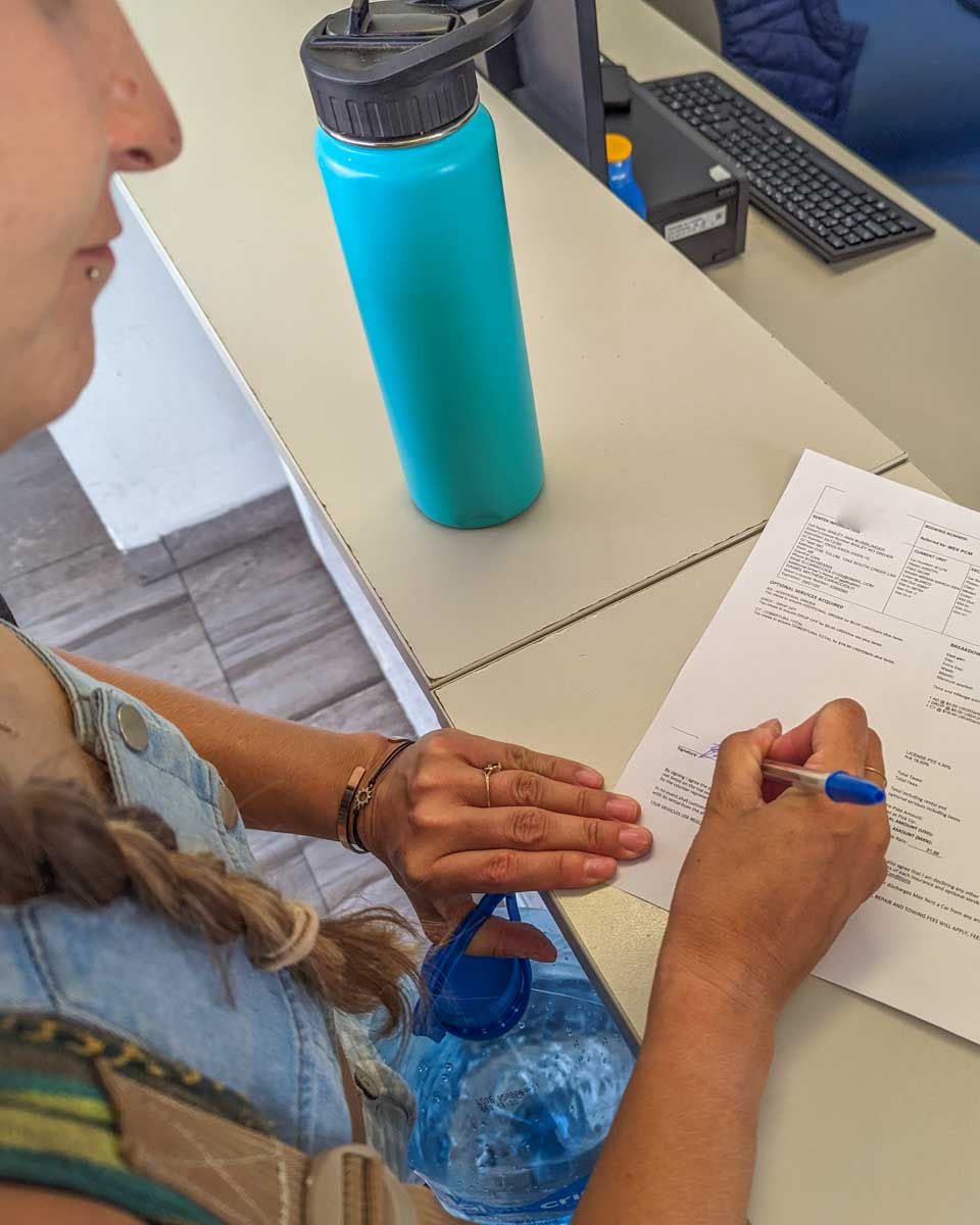 Bailey signs the final paperwork after dropping a rental car off in Mexico