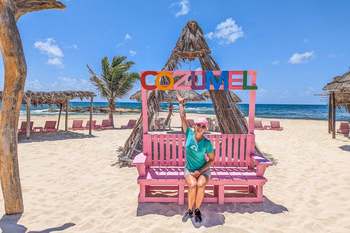Bailey takes a photo with a Cozumel Sign on Cozumel Mexico