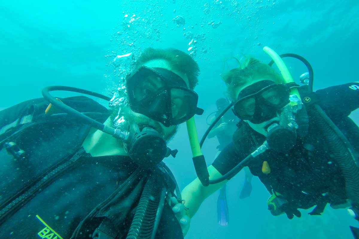 Daniel and Bailey take a selfie while scuba diving in Puerto Vallarta, Mexico