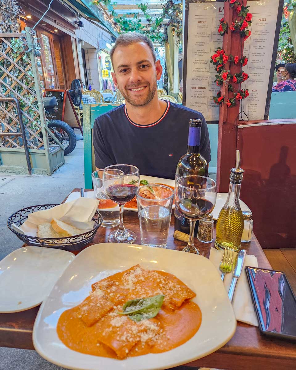 Daniel enjoys a pasta dish from L'Amore Restaurant in Little Italy New York City