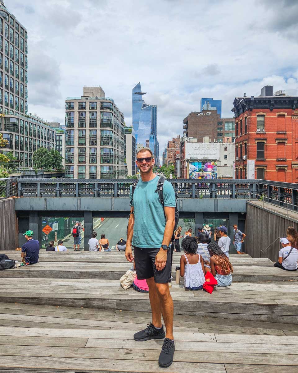 Daniel poses for a photo at one of the city viewpoints along the High Line in New York City